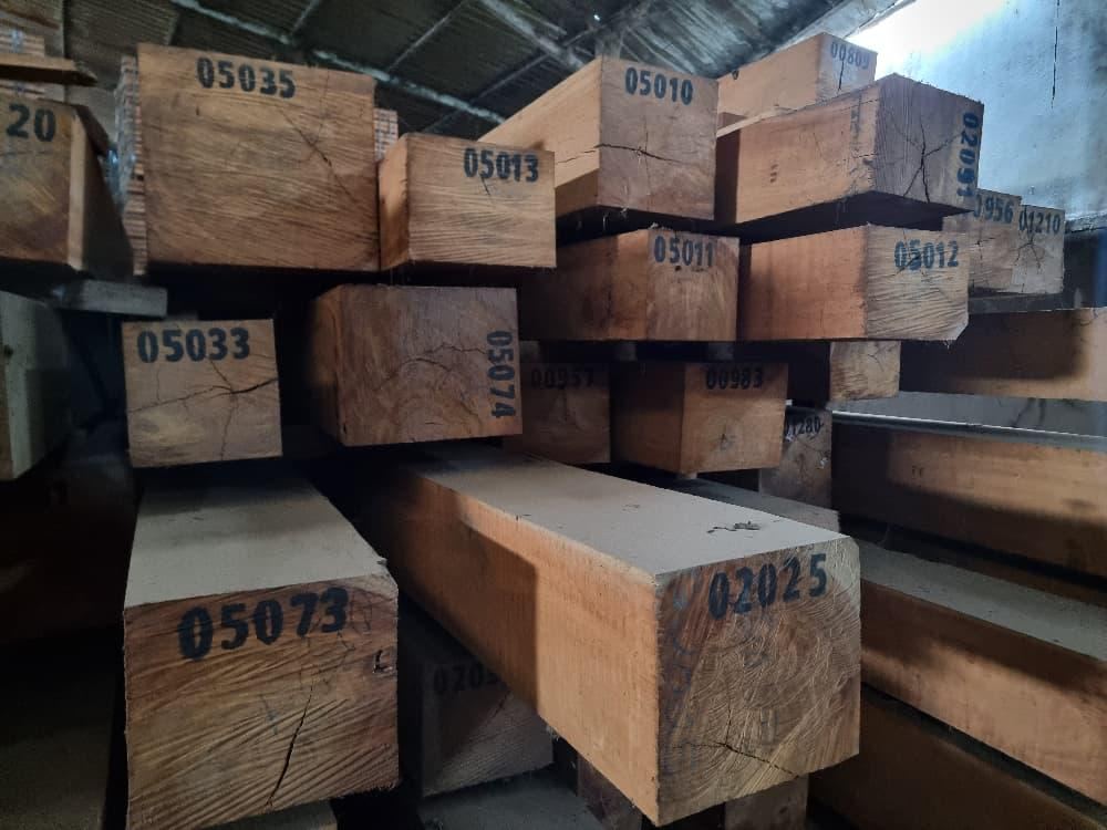 Tali squared timber stacked in a warehouse in Cameroon